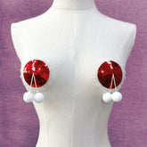 Pegatinas navideñas con lentejuelas pequeñas para pezones femeninos.